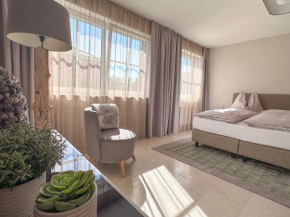 GLÜCKSMOMENT - beeindruckende Ferienwohnung mit shared Poolarea